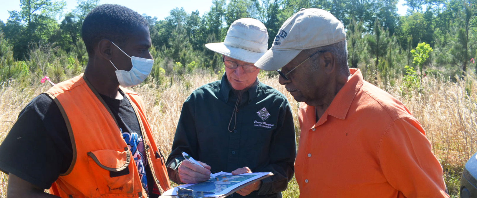 Foresters Kenneth Dunn (left) and David Bourgeois (center) with landowner Anthony Williams (right)