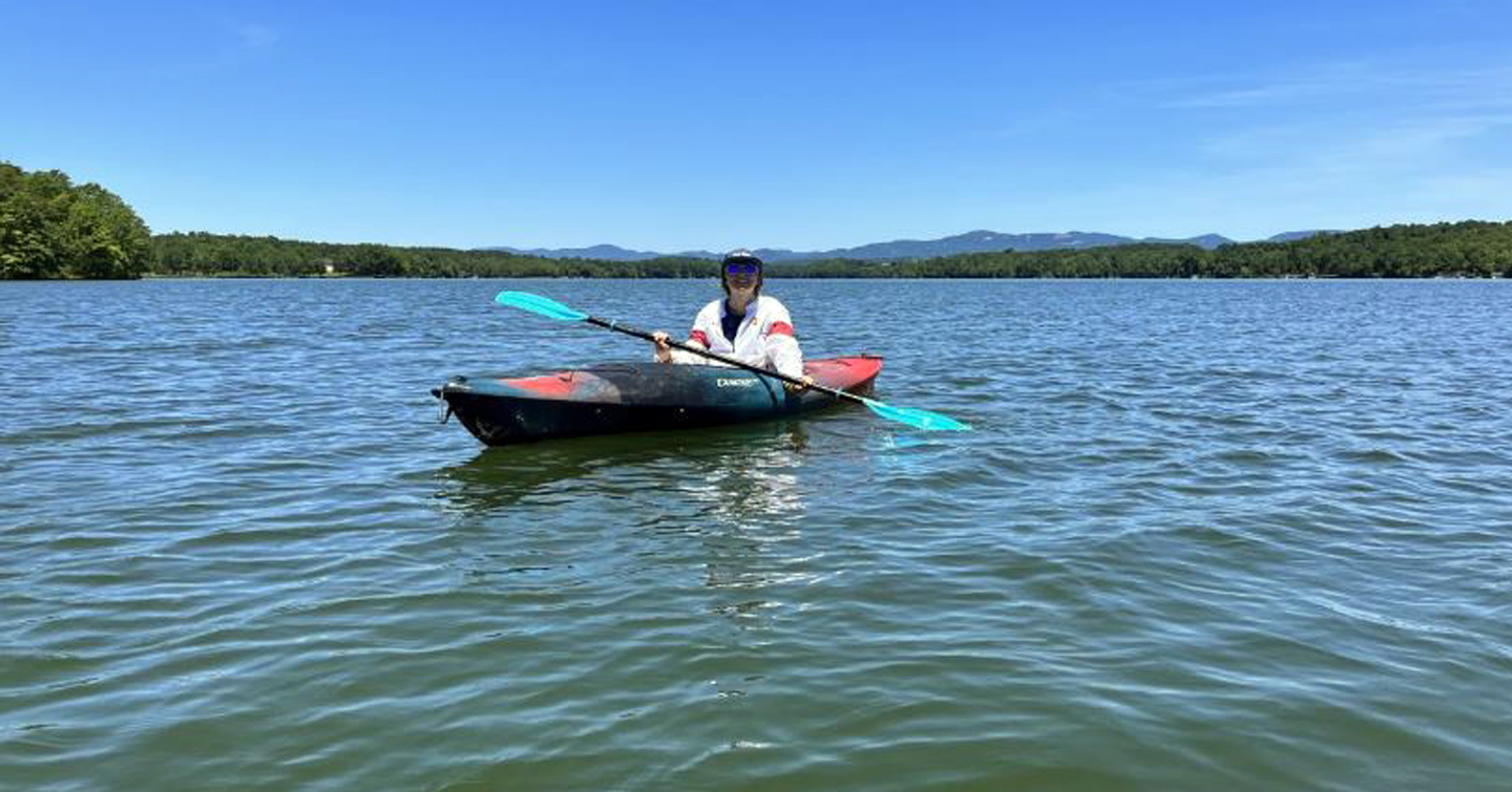Rebecca paddling on placid Lake Robinson