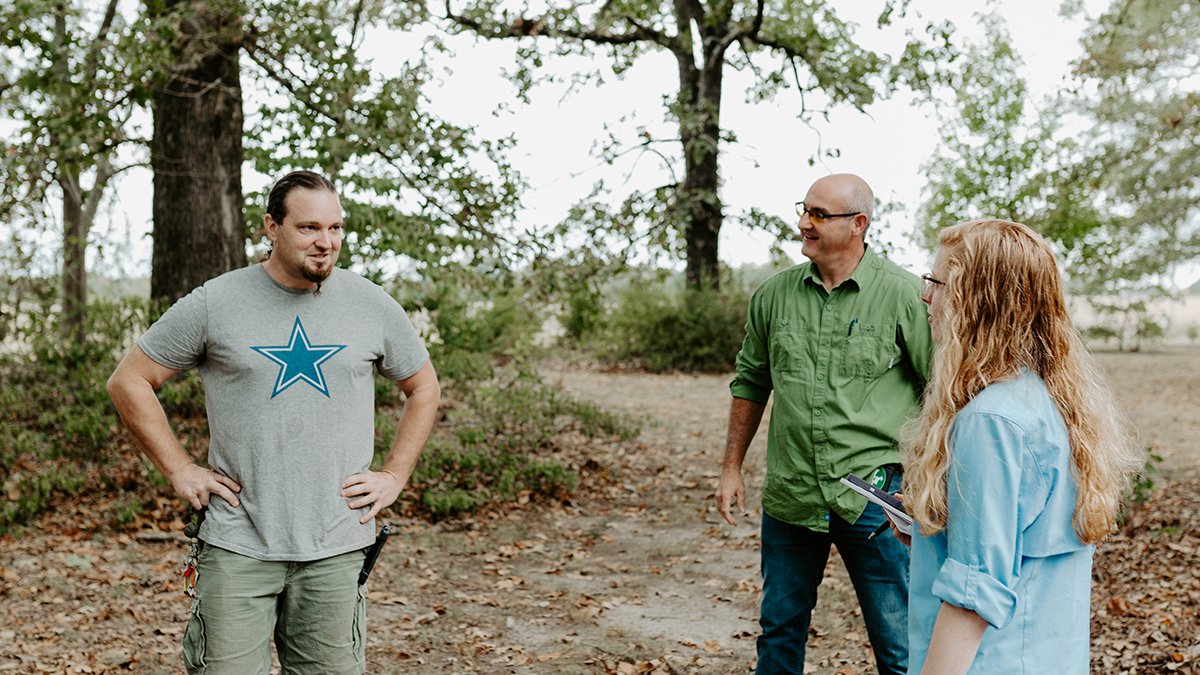 Chad Culbertson, Patrick Jackson, and Caitlyn Gendusa outside Timber Creek Farm. (Photo by Morgan Yelton, October 2019) 